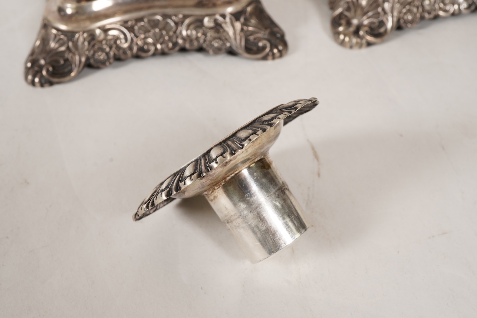 A pair of late 18th/early 19th century German white metal candlesticks, maker's mark W.C.H & S